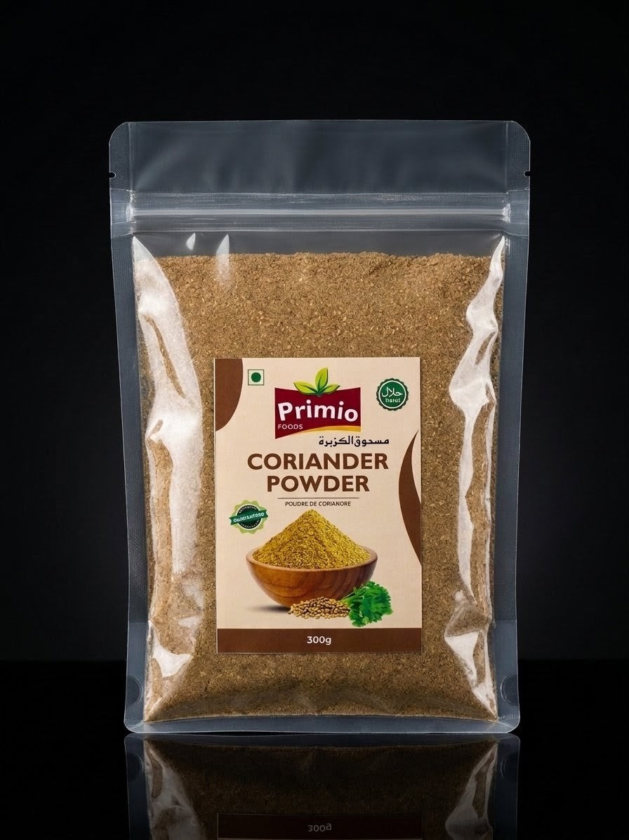 A 300g stand-up pouch of Primio Coriander Powder, filled with brown coriander spice, set against a solid black background with a subtle reflection below.
